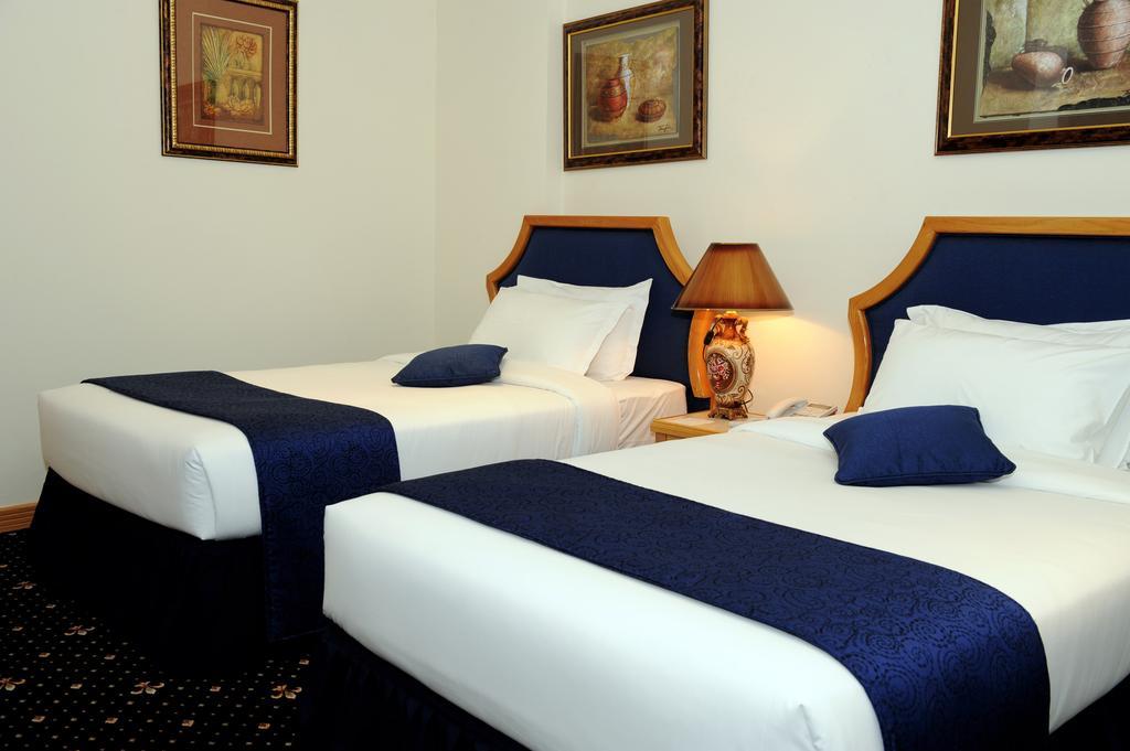 Cayam Hotel Доха Номер фото